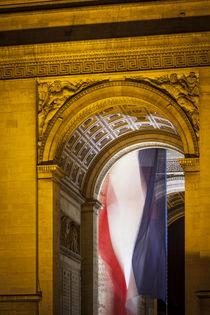 Flag flies inside the Arc de Triomphe, Paris, France. von Danita Delimont
