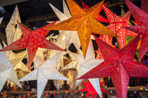 Hanging paper cutout star lamps, Christmas market, Mainz, Germany by Danita Delimont