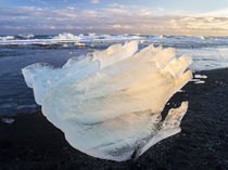Iceberg on black volcanic beach by Danita Delimont