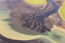 Aerial view of river estuary or delta, coloured by glacial melt, by Danita Delimont