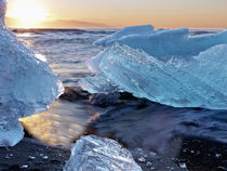 Sunrise and iceberg formation on the beach at Jokulsarlon, Iceland by Danita Delimont