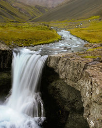 Water running from Glacier and waterfall, Iceland by Danita Delimont