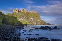 Sunrise over Dunluce Castle along northern coast of County A... by Danita Delimont