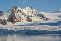Svalbard. Hornsund. Mountains surrounding the still water of... by Danita Delimont