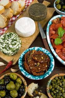 Maltese appetizer Gbejniet with capers, fresh tomatoes, drie... by Danita Delimont