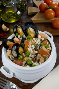 Seafood rice with mussels, shrimps, tomato, olives, peas, It... by Danita Delimont