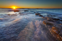 Sun rays illuminate the waters of the Pacific Ocean near Sun... by Danita Delimont