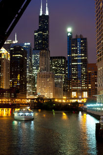 Chicago River and skyline at dusk with boat by Danita Delimont