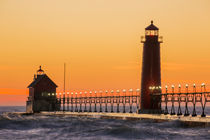 Grand Haven South Pier Lighthouse at sunset on Lake Michigan... by Danita Delimont