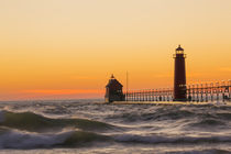Grand Haven South Pier Lighthouse at sunset on Lake Michigan... by Danita Delimont