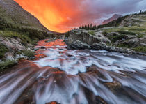 Brilliant sunrise sky over Swiftcurrent Falls in Glacier Nat... by Danita Delimont