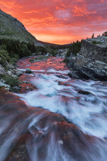 Brilliant sunrise sky over Swiftcurrent Falls in Glacier Nat... by Danita Delimont