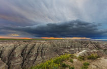 Dramatic storm cloud at sunrise in Badlands National Park, S... by Danita Delimont