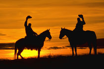 Cowboys on ridge at Sunset; Model Released by Danita Delimont