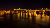 Night view of Prague castle and Charles Bridge by Zoltan Duray