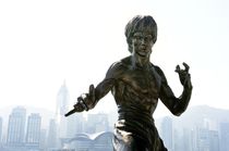 Bruce Lee against Hong Kong skyline by David Lyons
