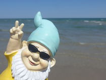 HELLO SUNSHINE... Funny garden gnome makes seaside holiday by Anela Krause