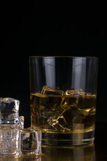 glass of whiskey and ice isolated on black background, whiskey, whisky, scotch, bourbon von Aleks de Kairo