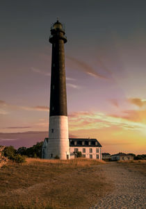 Sunset landscape with a lighthouse von Jarek Blaminsky
