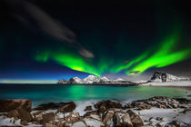 Aurora explotion. Raging Aurora with an amazing light show performance above Mt. Himmeltindene by Stein Liland