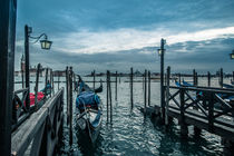 Venitian gondola at the pier waiting for costumers by amineah