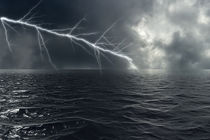 A bolt of lightning strikes over the sea in storm in Atlantic Ocean von fraenks