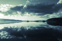 Clouds are reflected in the calm water of a glassy lake  - duotone by Intensivelight Panorama-Edition