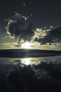 The sun is setting behind the hilly shore of a smooth forest lake - duotone von Intensivelight Panorama-Edition