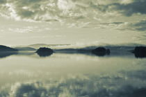 The cloudy sky is reflected in a glassy lake - duotone by Intensivelight Panorama-Edition
