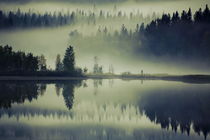 Golden glowing mist is rising from a dark forest at the shore of a glassy lake von Intensivelight Panorama-Edition