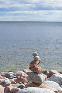 Pile of round stones at the shore of the ocean by Intensivelight Panorama-Edition