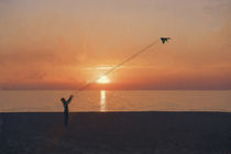 Kite flying at sunset by Robert Deering