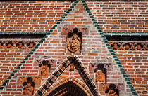 Brick Gate with Figurines by Marie Selissky