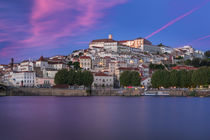 Skyline of city Coimbra with bridge Ponte Santa Clara at river Mondego during pink sunset, Portugal by Bastian Linder