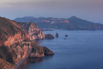 Coastline of island Lipari with view to volcan island Vulcano during sunset, Sicily Italy by Bastian Linder