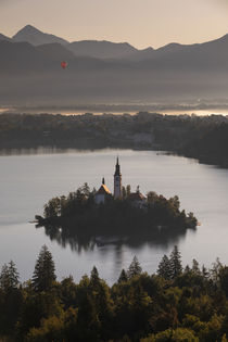 Church of pilgrimage Mariä Himmelfahrt on island in Lake Bled during sunrise, Bled Slovenia by Bastian Linder