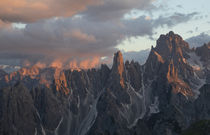 Mountain landscape in the European Dolomite Alps underneath the Three Peaks with alpenglow during sunset, South Tyrol Italy by Bastian Linder