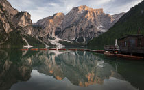 Boat house with boats at Lake Prags during sunset in the Dolomite Alps, South Tyrol Italy by Bastian Linder