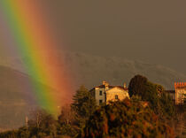 a colorful rainbow arch drawn in the sky by susanna mattioda
