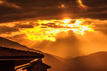 a golden sunset of threatening clouds  von susanna mattioda