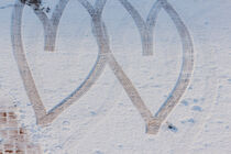 imprint of two hearts drawn in the snow by susanna mattioda