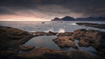 Seaside water pools at Gjogv in sunset with a view of Kalsoy, Faroe Islands by Bastian Linder