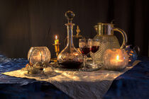 atmospheric still life with wine, glasses, carafe, candles by Margit Kluthke