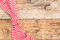 Rustic old wooden table background texture, with red checkered tablecloth by Alex Winter