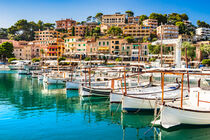 Coast of Port de Soller with fishing boats at pier by Alex Winter