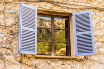 Light blue mediterranean window shutters and wall by Alex Winter
