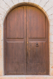 Wooden front door of residence front entrance by Alex Winter