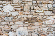 Texture of natural vintage stone wall background von Alex Winter