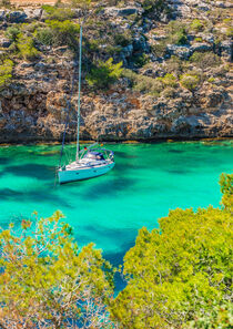 Majorca island, bay with anchoring sailboat yacht at the seasid, Spain Mediterranean Sea by Alex Winter