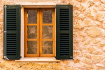 Open wooden window shutters and stone wall background von Alex Winter